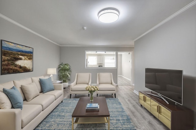 living area with ornamental molding, baseboards, and wood finished floors