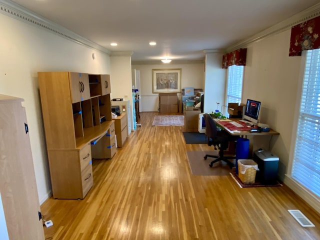 office with recessed lighting, visible vents, ornamental molding, light wood-type flooring, and baseboards