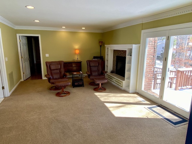 living room with recessed lighting, light carpet, baseboards, a tiled fireplace, and crown molding