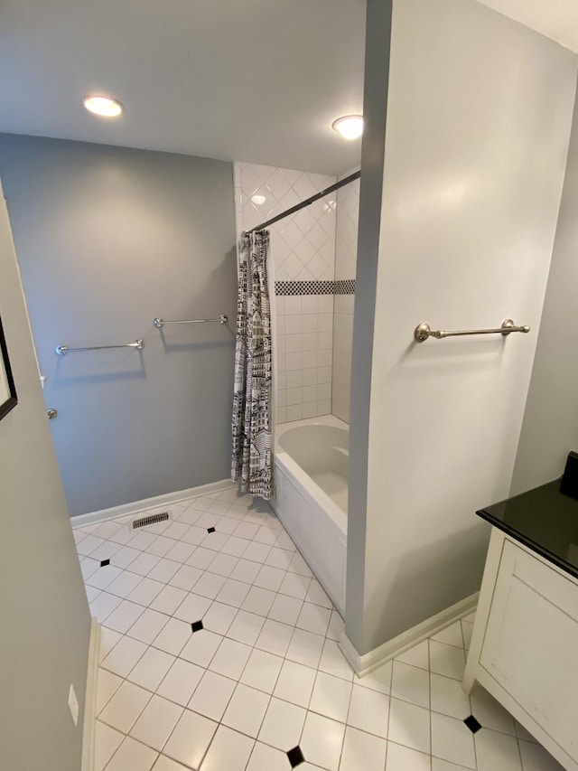 bathroom featuring visible vents, shower / bathtub combination with curtain, baseboards, and tile patterned floors