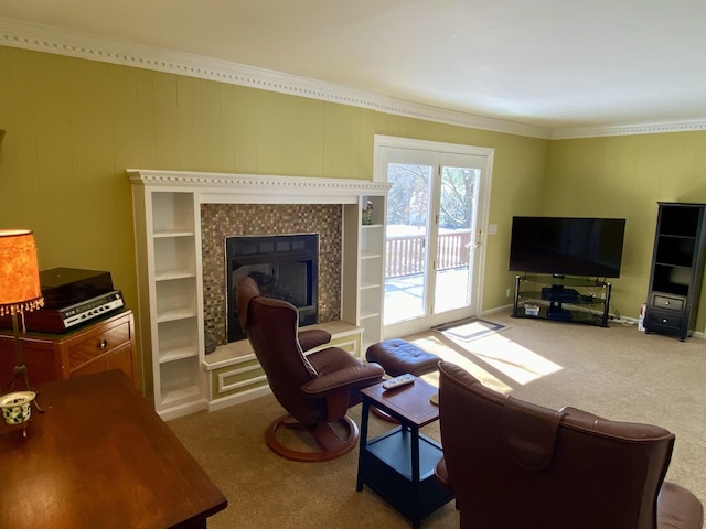 carpeted living area featuring a tile fireplace, crown molding, and baseboards