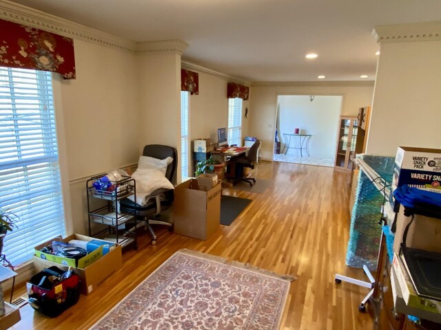 office with ornamental molding, recessed lighting, and wood finished floors