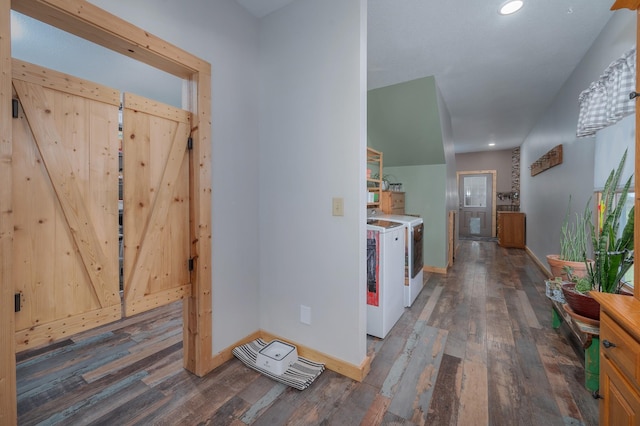 interior space with dark wood-style floors, baseboards, and separate washer and dryer