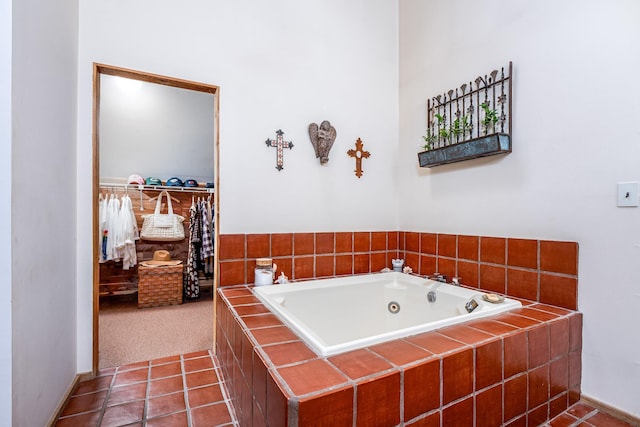 full bathroom with tile patterned floors and a bath