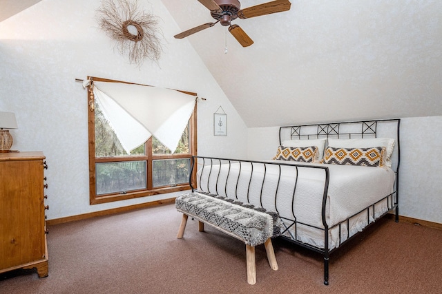 carpeted bedroom featuring a ceiling fan, lofted ceiling, and baseboards