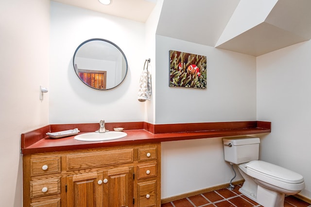 half bath featuring toilet, baseboards, and vanity