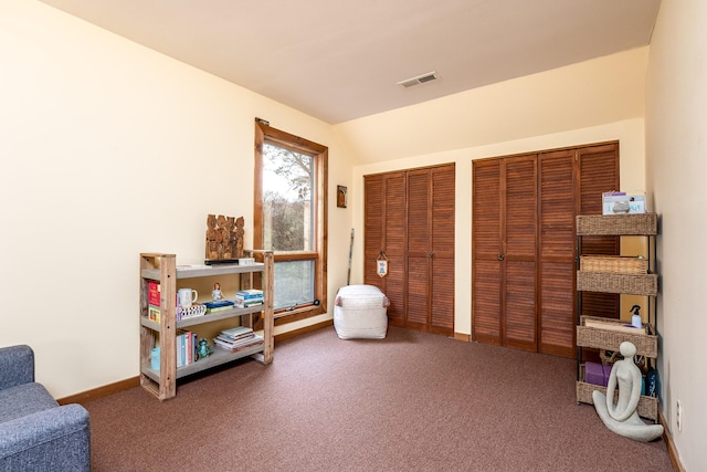 sitting room featuring carpet, visible vents, and baseboards