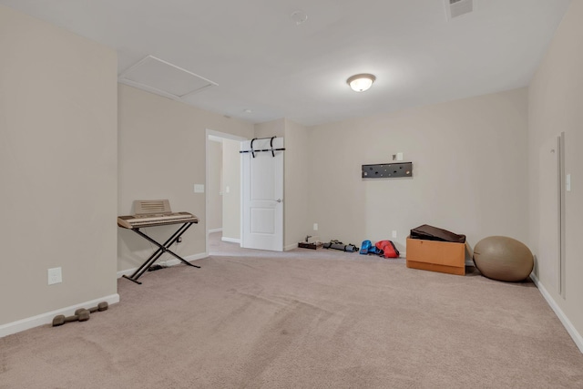 misc room featuring attic access, carpet flooring, visible vents, and baseboards