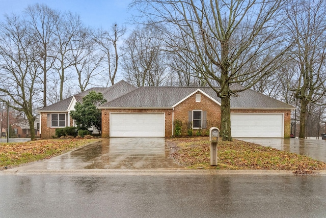 single story home featuring concrete driveway, brick siding, and roof with shingles