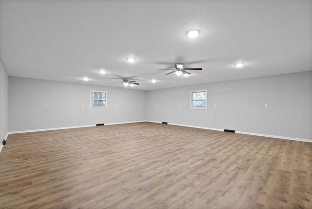 empty room featuring light wood-style floors and baseboards