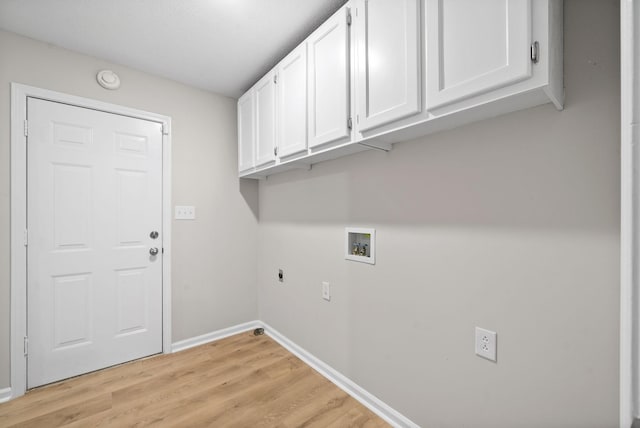 laundry room featuring washer hookup, cabinet space, light wood-style floors, electric dryer hookup, and baseboards