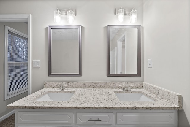 bathroom with double vanity and a sink