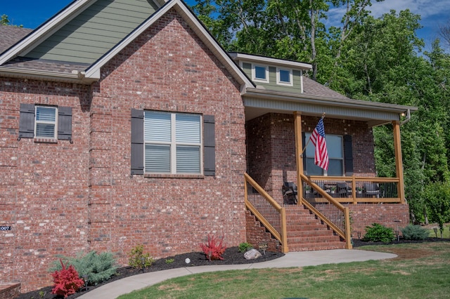 1007 Watercress Ct, Murfreesboro, TN 37129 - view of front of house featuring brick siding, a shingled roof, a porch, and a front yard