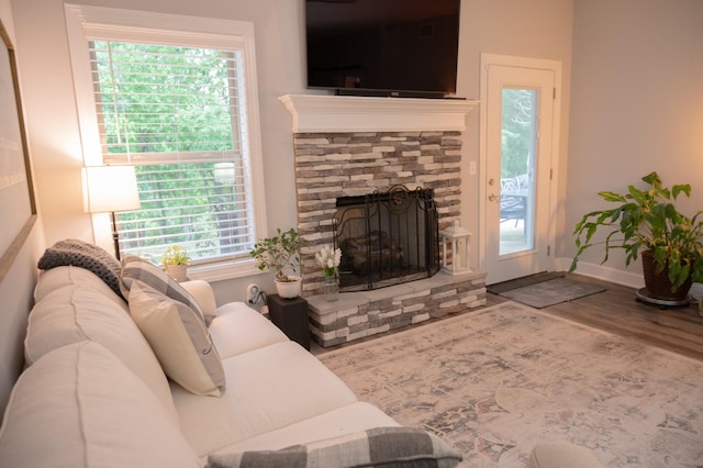 1007 Watercress Ct, Murfreesboro, TN 37129 - living area with wood finished floors, a stone fireplace, and baseboards