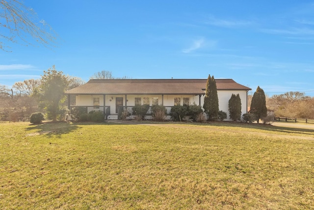 ranch-style home with a front lawn