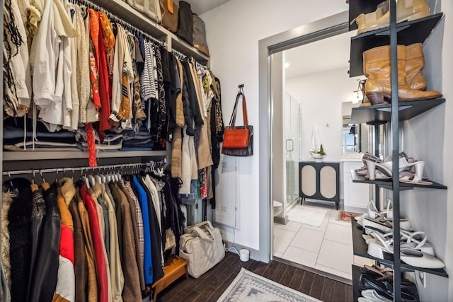 spacious closet with wood tiled floor