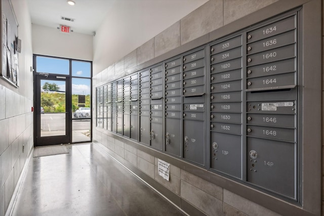 view of property's community featuring mail area and visible vents