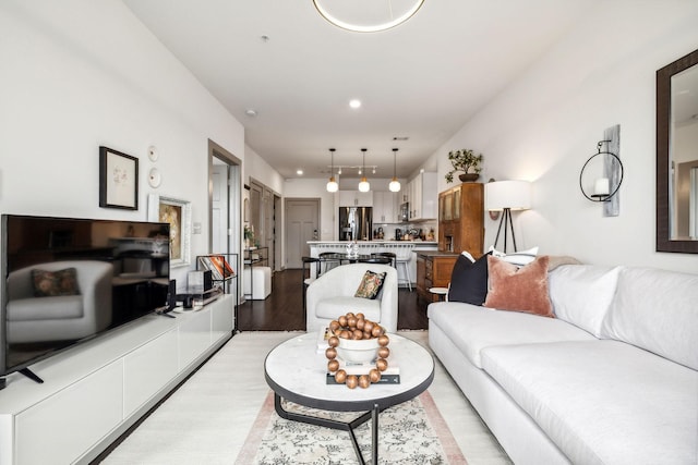 living room featuring recessed lighting and light wood finished floors