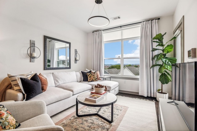 living room featuring visible vents