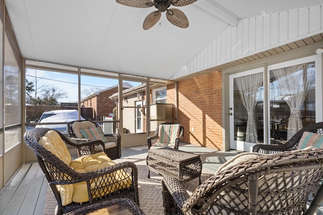 sunroom / solarium with lofted ceiling with beams and ceiling fan