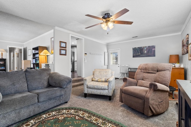 carpeted living room featuring a ceiling fan, crown molding, and a textured ceiling