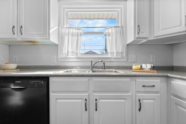 kitchen with white cabinets, dishwasher, and a sink