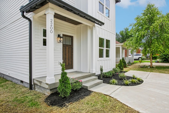 property entrance with board and batten siding