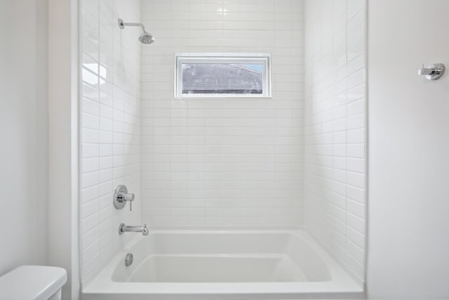 full bath with bathtub / shower combination and toilet