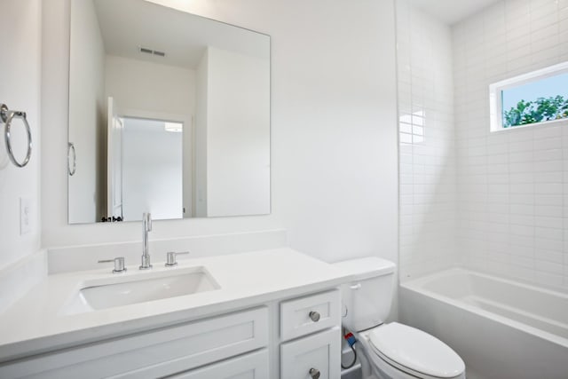 bathroom with shower / washtub combination, visible vents, vanity, and toilet