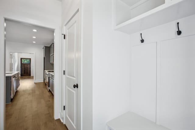 mudroom with recessed lighting and dark wood-style flooring