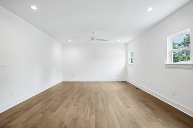 unfurnished room with light wood-style floors, recessed lighting, baseboards, and a ceiling fan