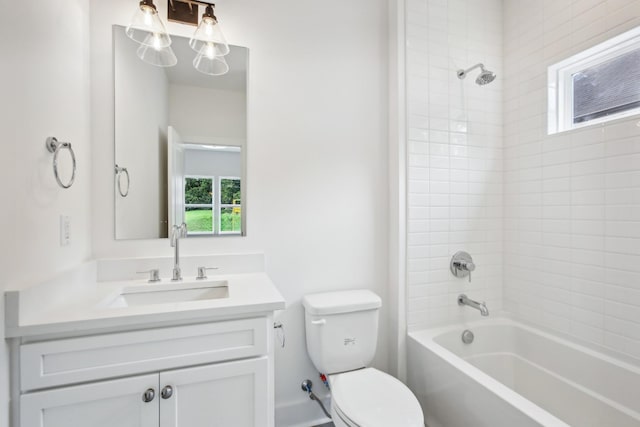 bathroom with toilet, washtub / shower combination, and vanity