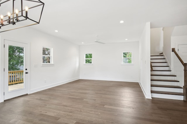 interior space with stairs, dark wood-type flooring, baseboards, and recessed lighting