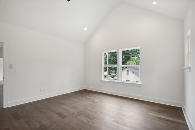 empty room featuring high vaulted ceiling, baseboards, dark wood-style flooring, and recessed lighting