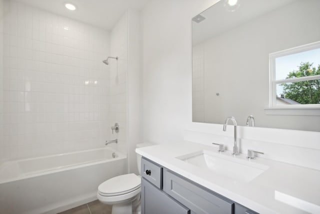 full bathroom featuring recessed lighting, shower / bath combination, toilet, vanity, and tile patterned flooring