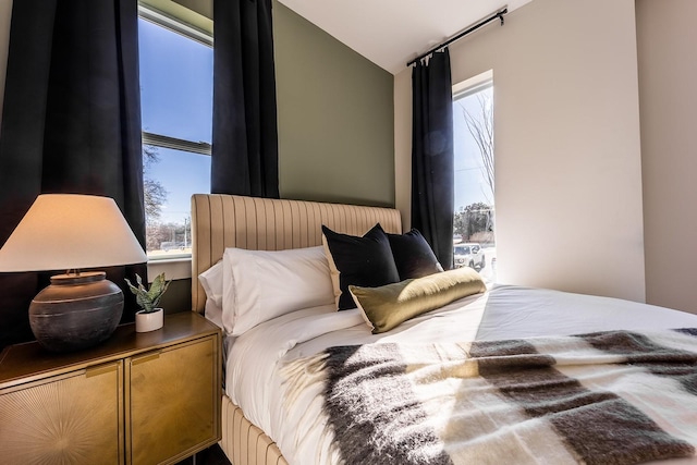 bedroom with lofted ceiling