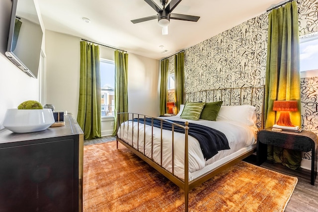 bedroom featuring ceiling fan and wood finished floors