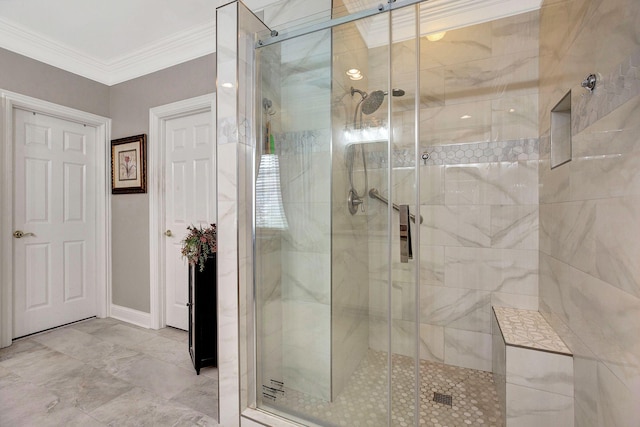 bathroom featuring ornamental molding, a stall shower, and marble finish floor