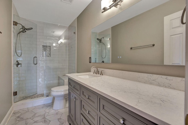 bathroom with visible vents, a stall shower, vanity, and toilet