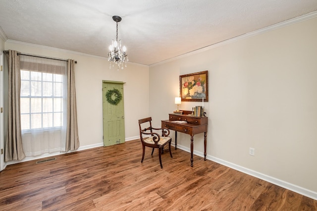 interior space featuring visible vents, a chandelier, wood finished floors, and ornamental molding