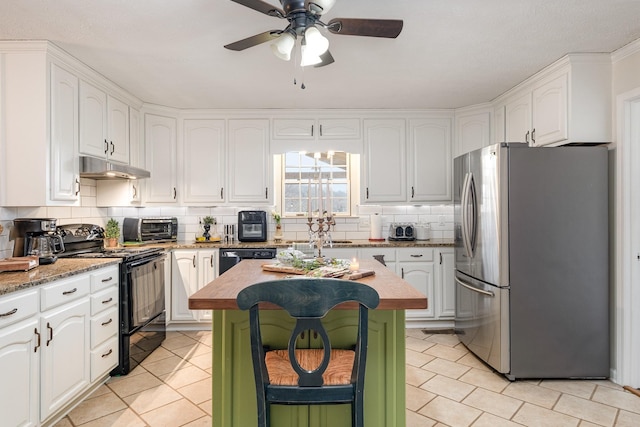 kitchen with tasteful backsplash, a center island, under cabinet range hood, black appliances, and white cabinetry