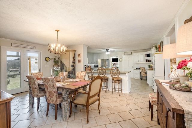 dining area featuring crown molding, a textured ceiling, and ceiling fan with notable chandelier