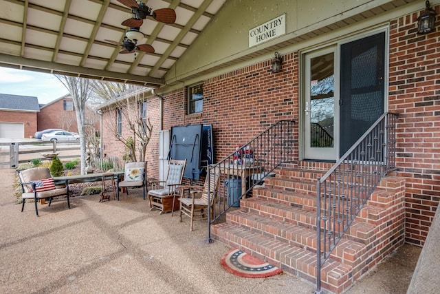 view of patio / terrace featuring a ceiling fan and entry steps