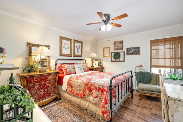 bedroom with crown molding, ceiling fan, and wood finished floors