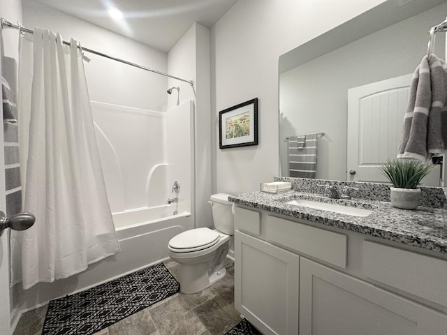 bathroom with shower / bath combo, vanity, and toilet