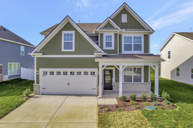 craftsman inspired home with a garage, brick siding, concrete driveway, board and batten siding, and a front yard