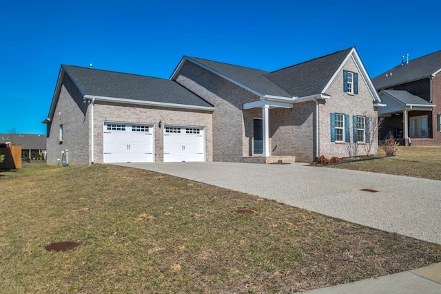 view of front of home with driveway, a garage, a shingled roof, brick siding, and a front yard