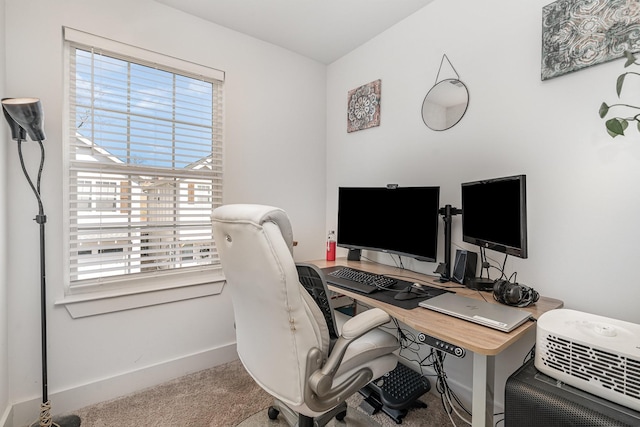 carpeted office with baseboards