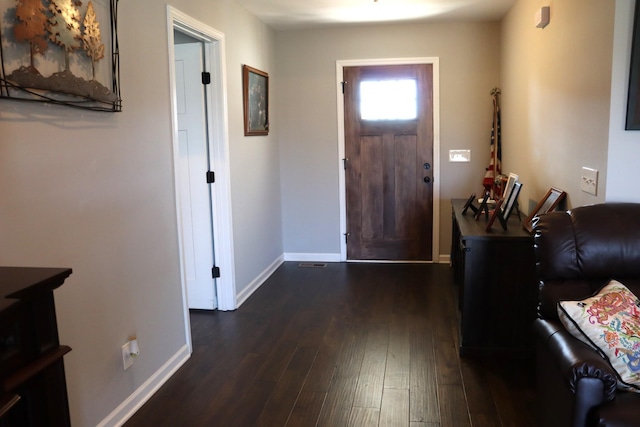 entryway featuring dark wood-style flooring and baseboards