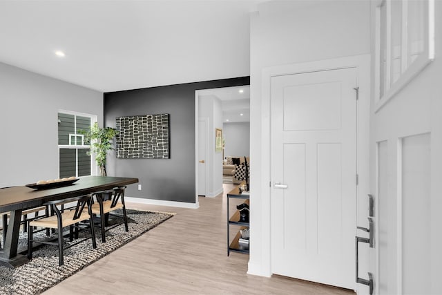 interior space featuring recessed lighting, light wood-style flooring, and baseboards